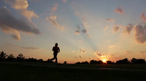 Jogger at sunset, panning Video stock 65218600