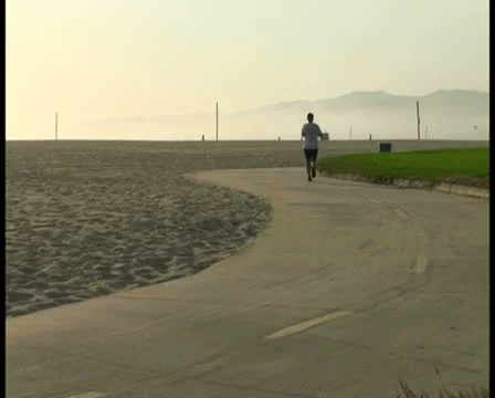 Jogger at sunset V2 - PAL Stock Footage