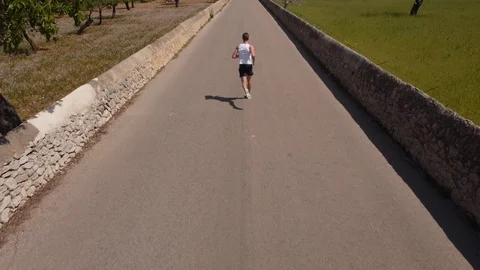 Jogger Topdown drone shot Stock Footage 118831611