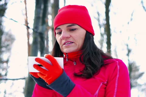 Jogger using cellphone in the forest at winter, steady, slow motion shot Stock-Footage 46991067