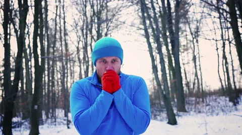 Jogger warming up in the forest at winter, steady, slow motion shot at 240fps Video stock 46888839