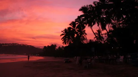 Joggers on Pink Sunset Beach Stock Footage 45615799