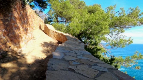 Jogging along the coastal cliffs. View from the runner perspective. Picturesque Stock Footage 123122006
