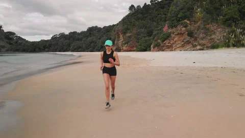 Jogging and exercising on a beautiful tropical beach Stock Footage 152386629