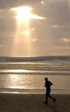 Jogging on the beach 写真素材