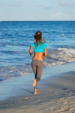 Jogging at beach Stock Photos