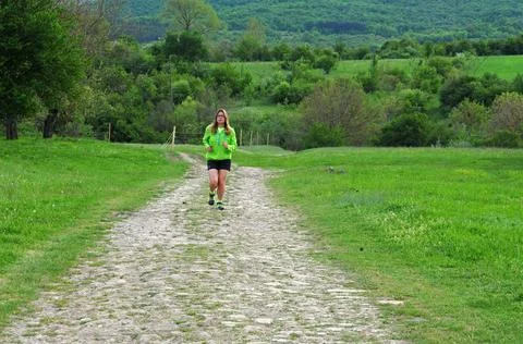 Jogging in countryside Stock Photos