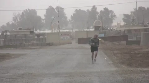 Jogging in Iraqi Sandstorm Stock Footage 1018288