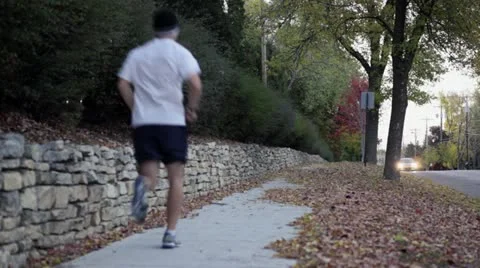 Jogging Man Fall Sidewalk Stock Footage 12316715