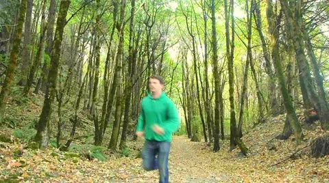 Jogging Man on Forest Path 1 Stock Footage 12144408