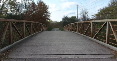 Jogging Over A Bridge In The Park First Person View 4K Stock Footage 88948182