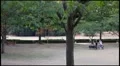 Jogging at park (pan shot) HD Footage