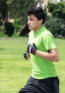 Jogging at park vertical Stock Photos