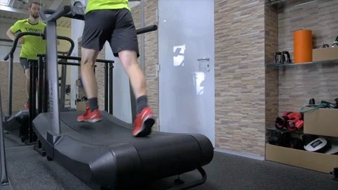 Jogging with pleasure. mirror image of young handsome man running on treadmill Stock Footage 113481021