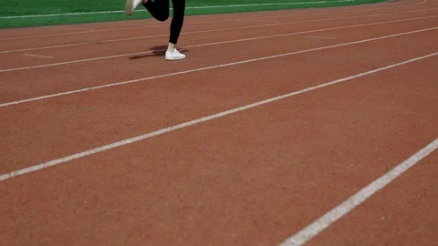 Jogging on racetrack in a distance Stock Footage 95085418