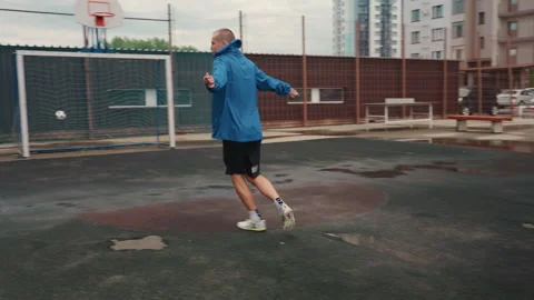 Jogging in rain, Athlete practicing in wet conditions, Male runner performing Stock Footage 331207625
