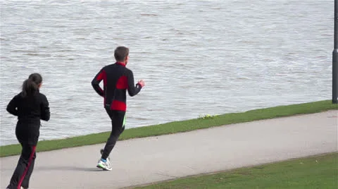 Jogging by the river Video stock 22679935