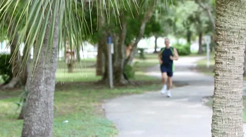 Jogging senior man in park Stock Footage 20566846