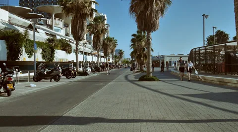 Jogging sidewalk beach summertime slow motion slow mo Stock Footage 39316253