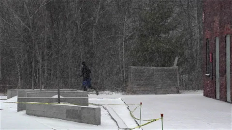Jogging in snow storm. Slow Motion. Stock Footage 47416399