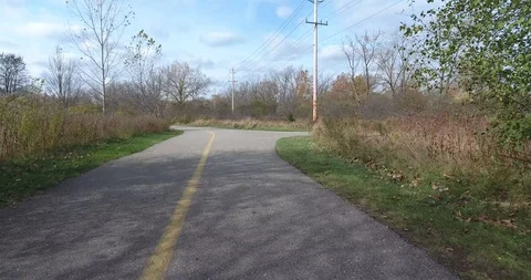 Jogging Towards Fork In The Road In Park First Person View 4K Stock Footage 88948369