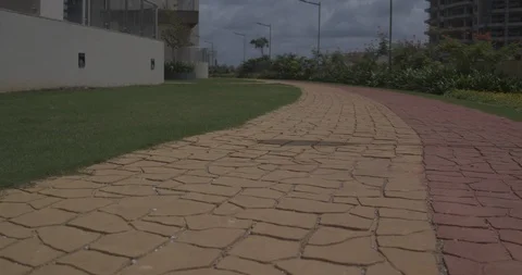 Jogging track in a park - low angle tracking Shot on DJI Drone Stock-Footage 90758249