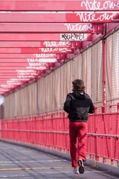 Jogging on Williamsburg bridge. Stock Photos