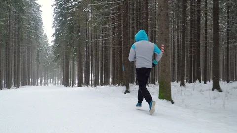 Jogging in the winter park Stock Footage 88177445
