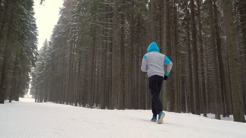 Jogging in the winter park Stock Footage 88179801