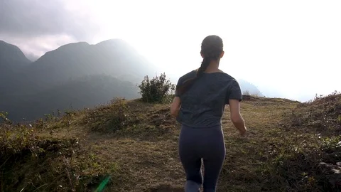 Joging on mountain cliff Stock Footage 89471790