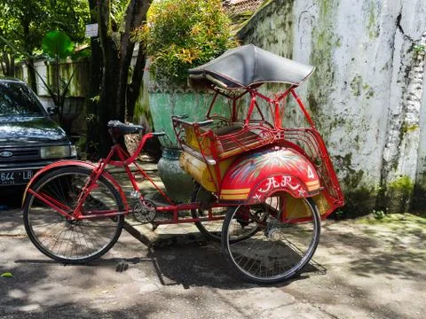 JOGJA, INDONESIA - AUGUST 12, 2O17: A traditional pedicap transport parket at Stock Photos