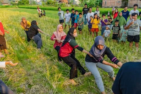 Jogja, Indonesia - August 8, 2025. asian youth competing in a lively tug of w Stock Photos