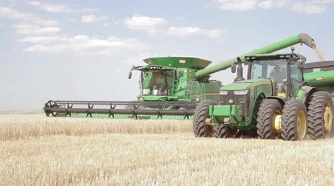 John Deere Combine and Grain Cart Close Up Stock Footage 65029111