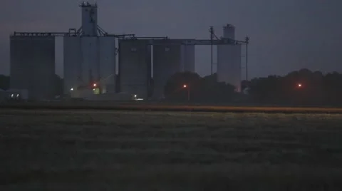 John Deere Combine Wide Shot Night Footage - Wheat Harvest Video stock 65026732
