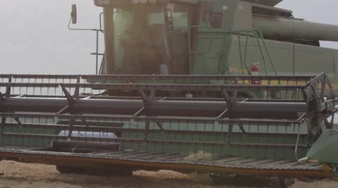 John Deere Combines Pan Across - Wheat Harvest Stock Footage 65026702