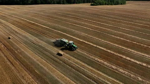 John Deere L1534 Square Baler making Hay Bales in an agricultural field. 스톡 동영상 212088280
