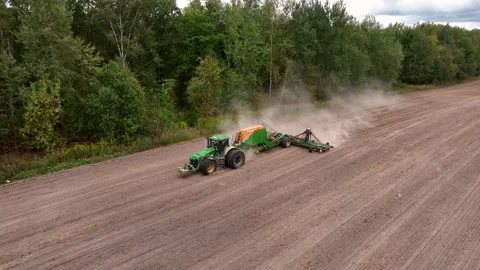 John Deere tractor with Amazone Condor on wheat seeding at field. Stock Footage 213542523