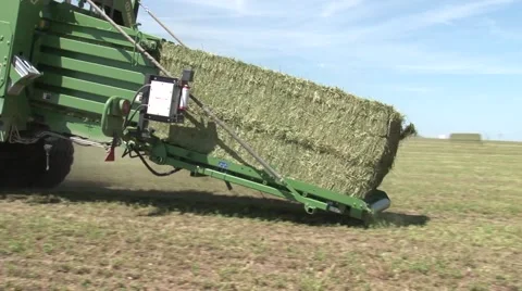 John Deere Tractor Bailing Close Up of Bail Stock Footage 40454599