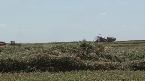 John Deere Tractor Bailing Far Pan Right Stock Footage 40452820