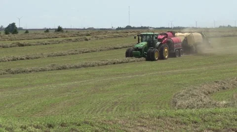 John Deere Tractor Bailing Far Pan Left Stock Footage 40452832
