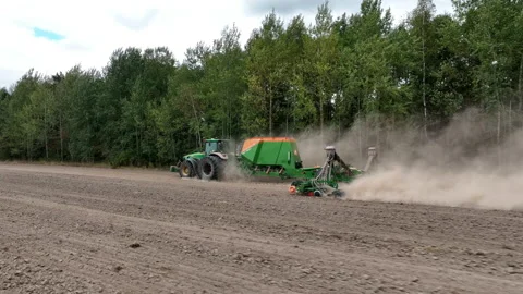 John Deere tractor with Condor trailed seed drill. wheat seeding Video stock 212600390