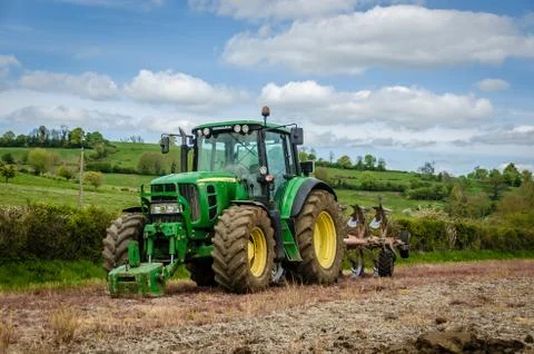 John Deere tractor with a Plow Stock Photos