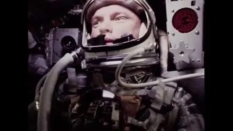 John Glenn operating controls during spaceflight onboard Mercury Stock Footage 262065091