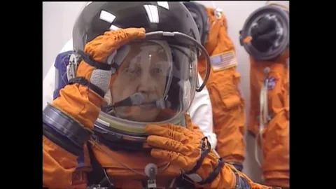 John Glenn testing spacesuit helmet prior to flight on space shuttle Discovery Stock Footage 262065061