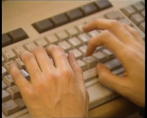 John Harrisonn talking about press while people are working, UK 1990 Stock Footage 147438138