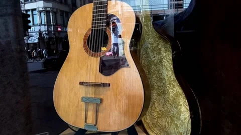 John Lennon's lost guitar up for auction in New York, LONDON, GB - 05 May 2024 Stock Footage 274434931