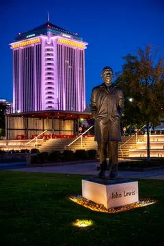 John Lewis Statue at Riverfront Park with Montgomery Skyline at Night Stock Photos