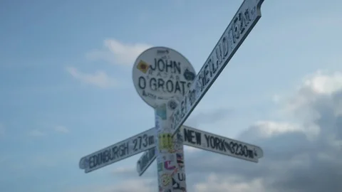 John O Groats sign post Close up pull focus and tilt pan Stock Footage 104862897