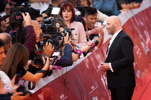 John Travolta interviewed on the red carpet, at the Rome Film Festival. Stock Photos
