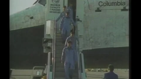 John Young and crew members descending steps from Space Shuttle Colombia STS-9 Stock Footage 270936842